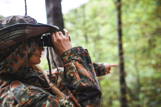 istock Woman patrol with binocular 697604674