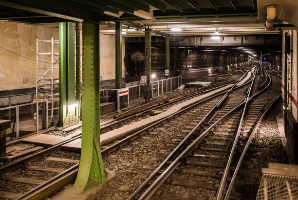 istock Railroad Tracks In Illuminated Tunnel 697606847
