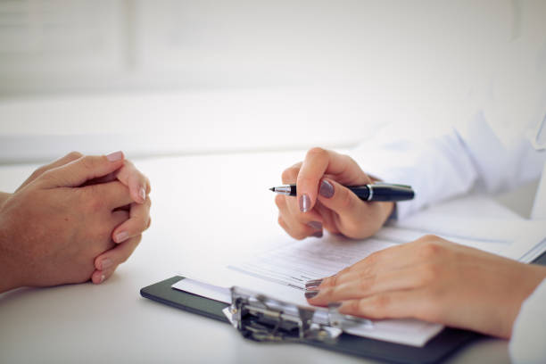 istock Doctor and patient are discussing something, just hands at the table 697607766