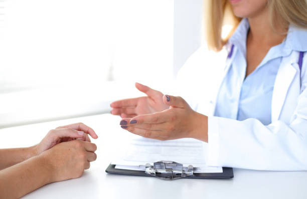 istock Doctor and patient are discussing something, just hands at the table 697607902