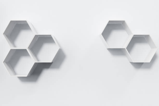 istock Empty white wall with hexagon shelves on the wall, 3D rendering 697612382