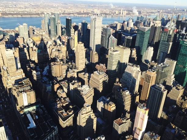 istock Cityscape Seen Through Empire State Building On Sunny Day 697613247