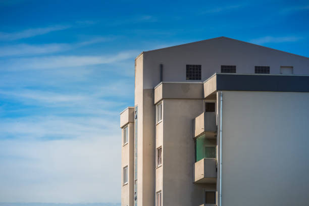 istock Upper part of a high-rise against a blue sky 697613340