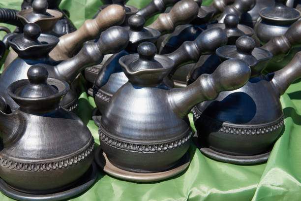 Ceramic handmade cezves in natural sunlight