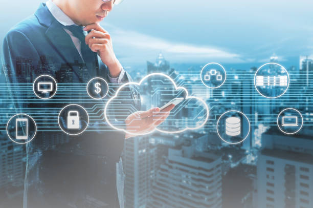 istock Double exposure of professional businessman connected Cloud technology with internet and wireless network with his smart phone and city of business background in business trading and technology concept 697619758