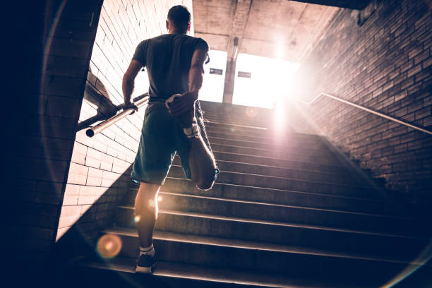 istock Image of a fit man stretching his legs 697621976