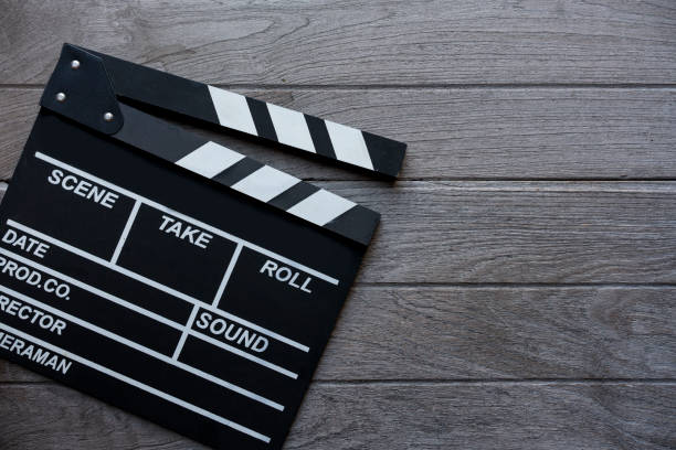istock movie clapper on wood table 697626882