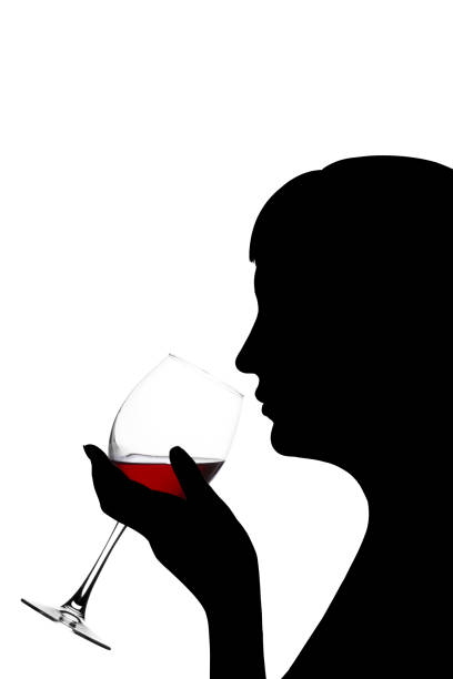 istock Girl is drinking red wine on a white background 697627454