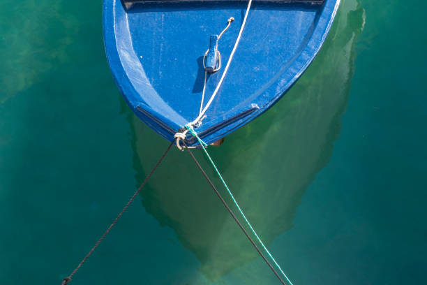 istock High Angle View Of Blue Boat In Sea At Harbor 697627607