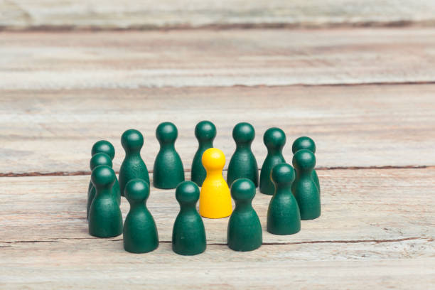 istock Close-Up Of Wooden Peg Dolls On Table 697633747