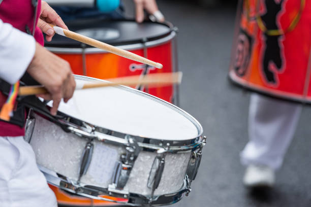 istock drummer with a snare drum - blurry - close up 697636152
