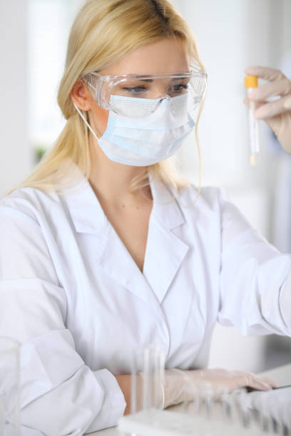 istock Female scientific researcher in laboratory 697640114
