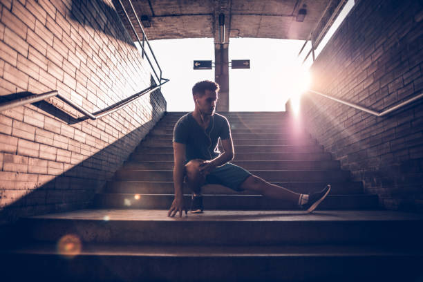 istock Image of a fit man stretching his legs 697640876