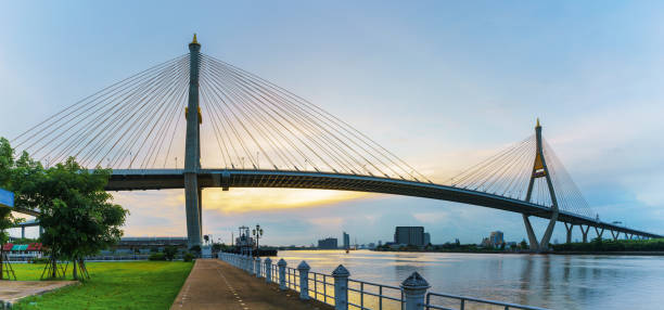 istock Panoramic image of Bhumibol  bridge so called Industrial Ring Bridge crossing The Chao Phraya River  , Bangkok, Thailand 697646472