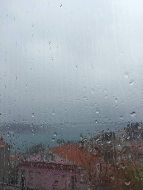 istock Rain drops on window against buildings in Istanbul, Turkey 697648446