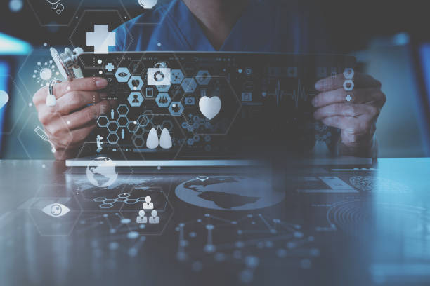 istock medical techonlogy concept,smart doctor hand working with modern laptop computer in modern office with virtual icon diagram 697650892