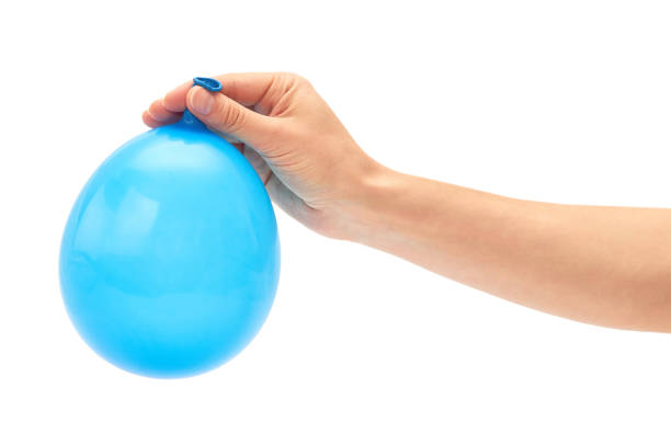 istock Female hand holds single blue party balloon. isolated on white background 697657172
