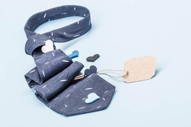 istock Dark blue tie and small hearts with a name tag 697661074