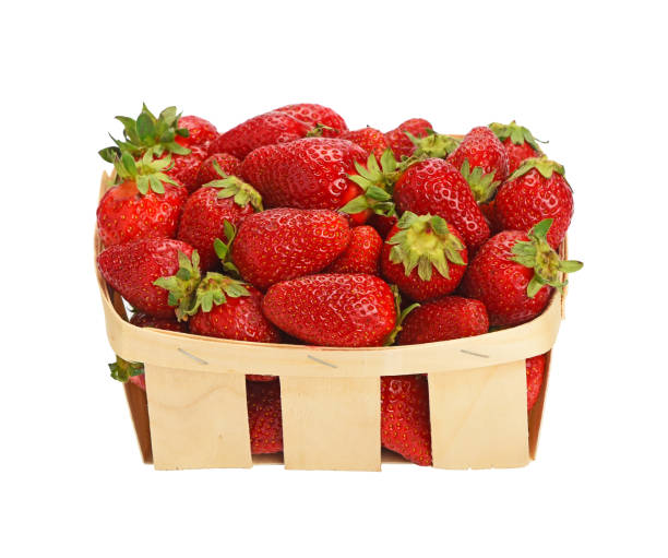 istock Red ripe strawberries in wooden basket over white 697663986