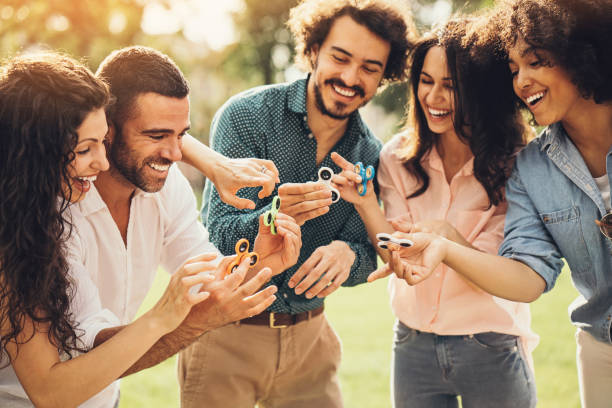istock Group of friends with spinners 697668186