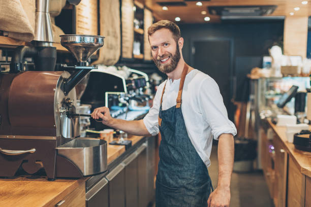 istock Male barista preparing coffee 697668194