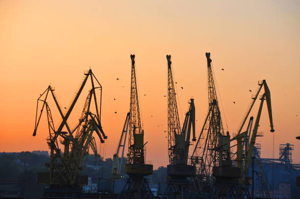 istock Port cargo crane at sunset 697668378