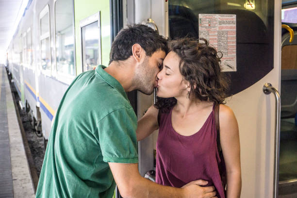 istock A young loving couple saying goodbye in a train station 697674620