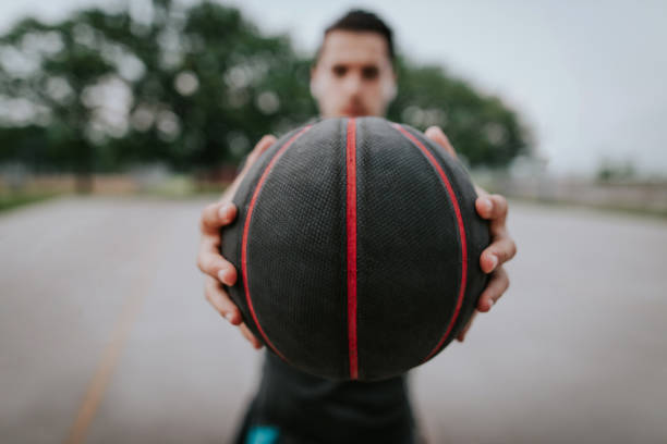 istock Man with basketball in hands 697675046