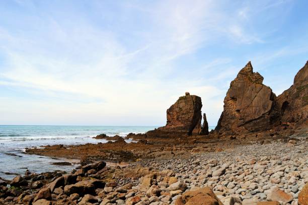 istock Scenic beautiful rocks and mountains at sea beach in Cornwall 697675096