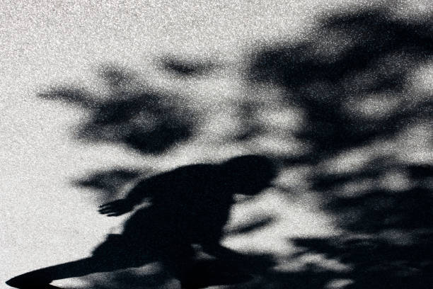 istock Blurry shadow of a man and treetop 697678348