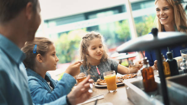 istock Young family having lunch. 697678620
