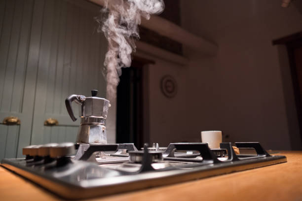 istock Moka pot coffee maker on the stove top 697685174
