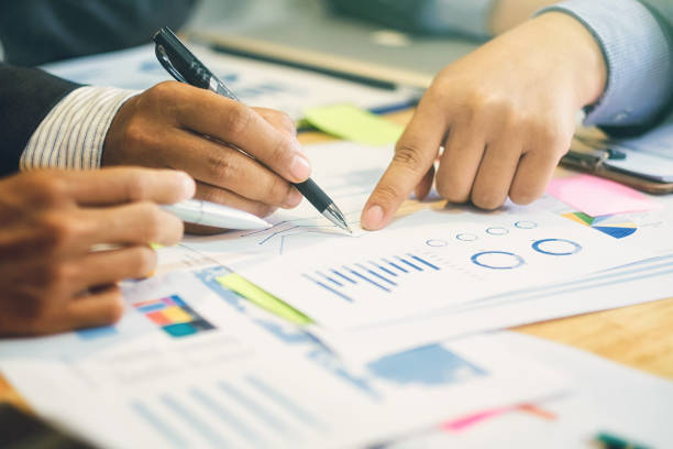 istock Business teamwork people meeting design Ideas and analyzing income charts and graphs. concept business planning. close up business workplace strategy Concept. 697686076