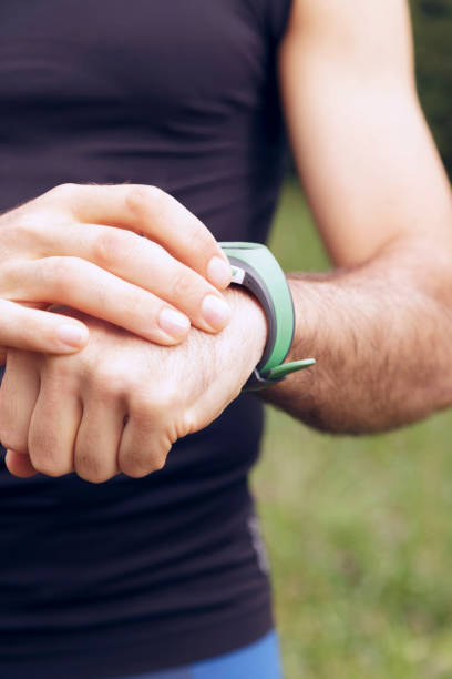 istock Male runner checking his smart watch outdoors. 697688632