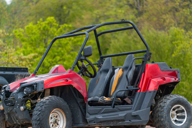 istock ATV are standing on the ground in the woods 697689440