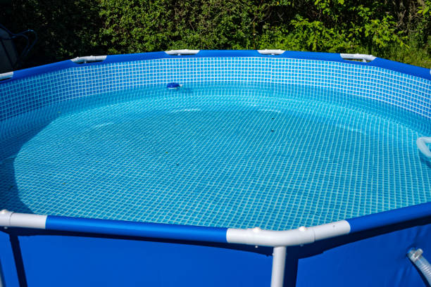 istock Blue pool for building is in the garden 697695084