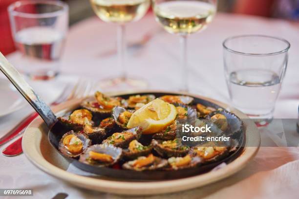 Grilled Limpets Served With Lemon Stock Photo - Download Image Now - Madeira Island, Food, Restaurant