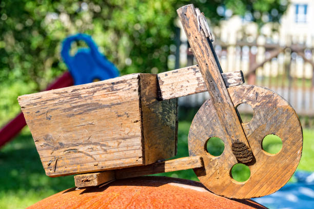 istock Age deco wooden scooters in the garden 697699376