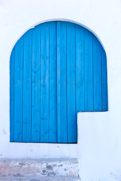 istock mediterranean blue wooden door 697705658