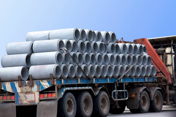 istock Concrete pipes on trailer prepare to deliver to construction site. 697712546