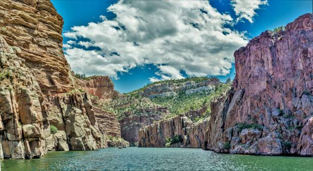 istock Magnificent Mountain Colors and Clouds and Waterway 697715526