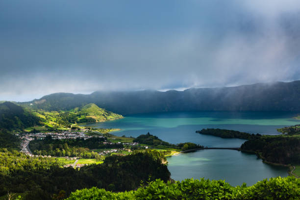 istock Blue and green lake in volcano craters 697716054