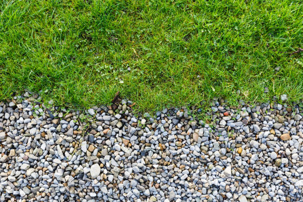 istock Gray gravel and green grass pattern 697716454