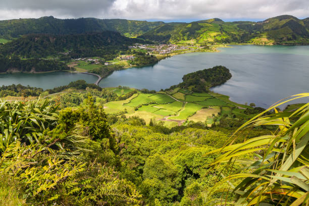 istock Blue and green lake in volcano craters 697730144