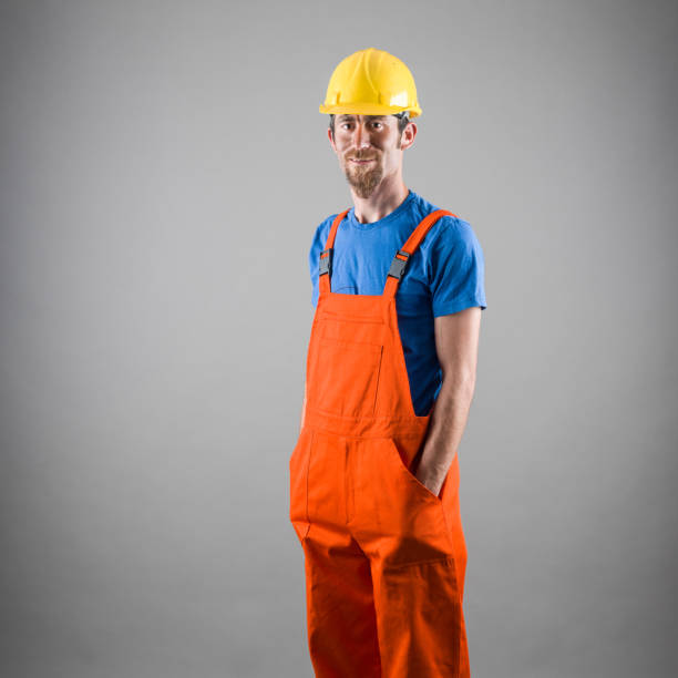 Portrait of Manual Worker Wearing Protective Clothes And Hardhat