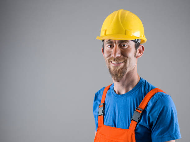 istock Portrait of Manual Worker Wearing Protective Clothes And Hardhat 697735340