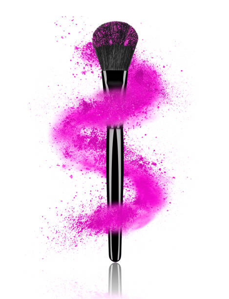 istock Cosmetic powder whirls around make-up brushes on white background 697735710