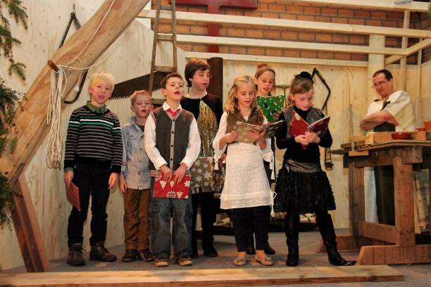 Christmas Representaion Schinnen, the Netherlands, - December 25, 2012.  Representation of a Bible story with actors and children in a Carpenter workshop at Christmas. song title stock pictures, royalty-free photos & images