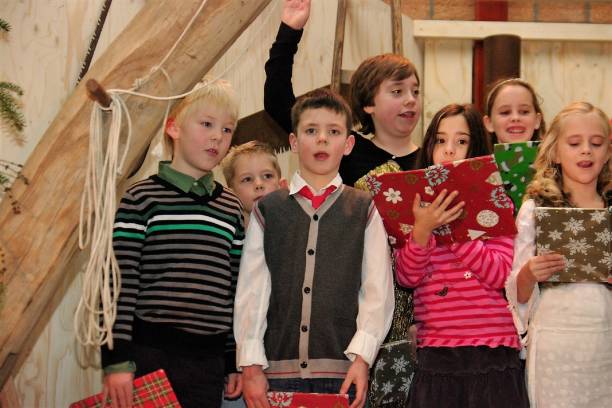 Christmas Representaion Schinnen, the Netherlands, - December 25, 2012.  Representation of a Bible story with actors and children in a Carpenter workshop at Christmas. song title stock pictures, royalty-free photos & images