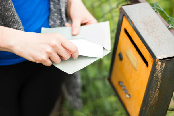 istock Woman, letter and mailbox 697740544